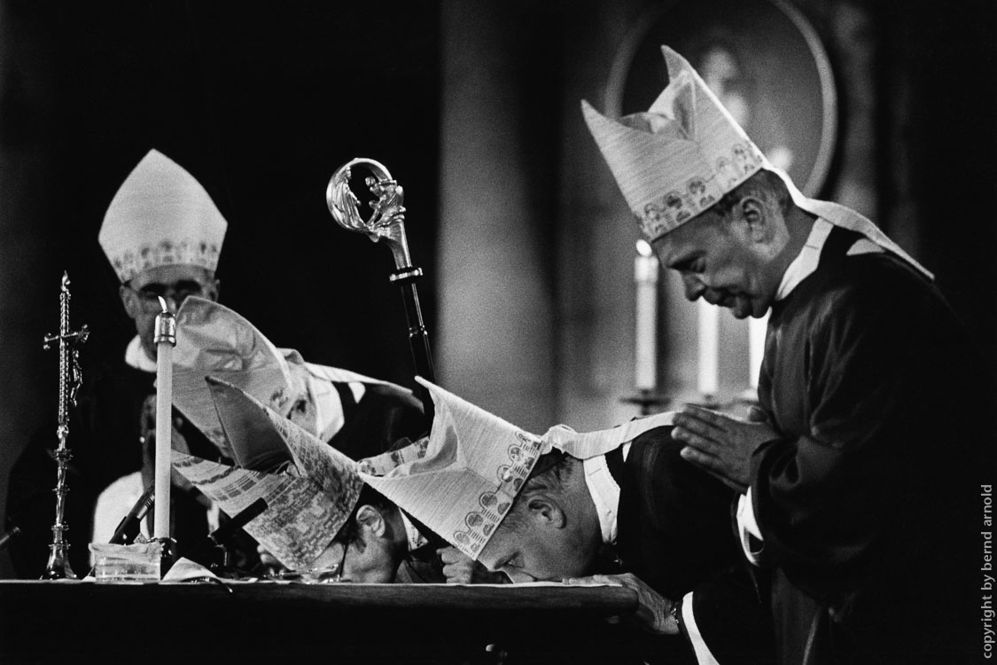 arcbishops are kissing the altar in catholic church cologne cathedral