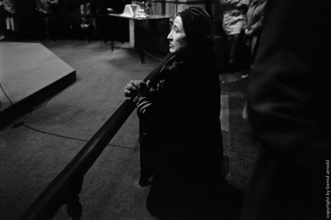 Praying old woman in Cologne Cathedral